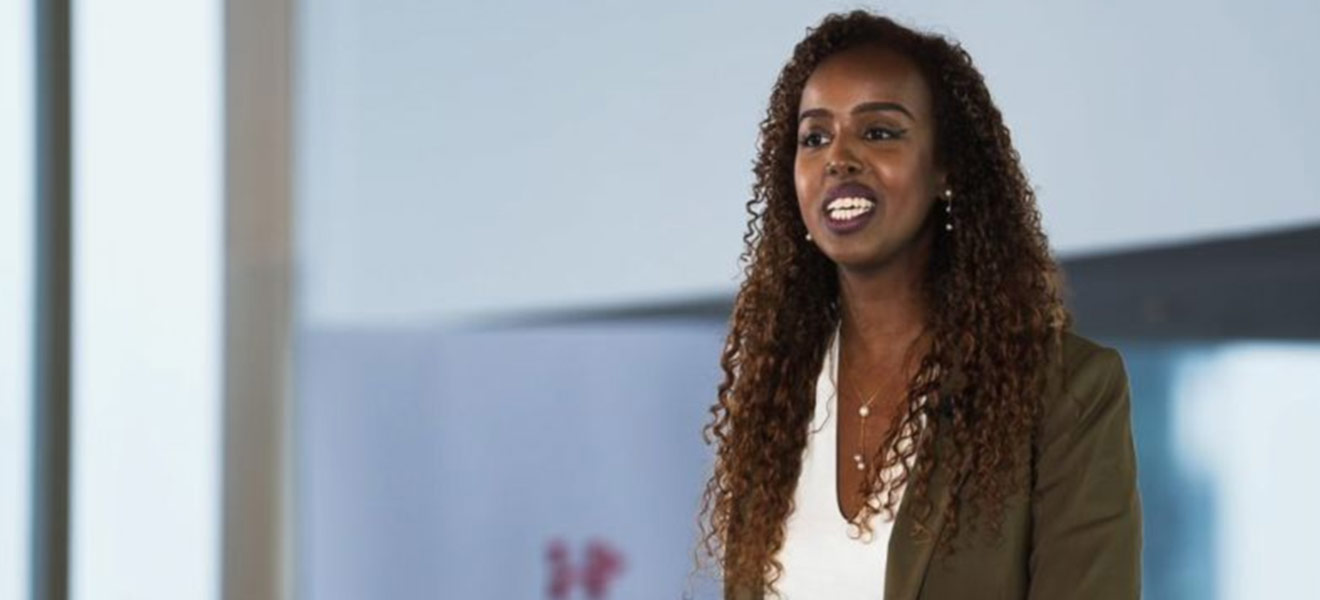 Woman speaking on a stage