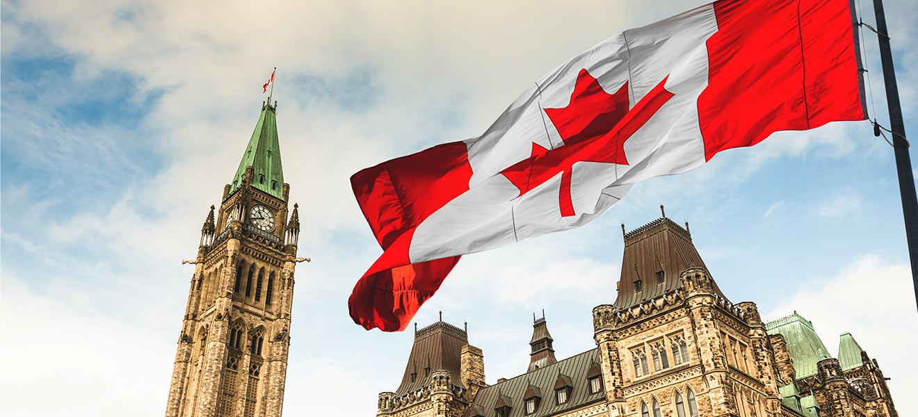 Canadian flag waving in front of parliament